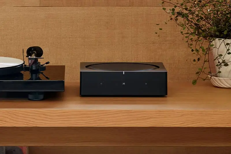 Sonos Amplifier front view on a table.